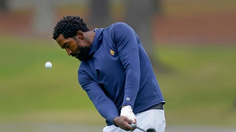 North Carolina A&T's J.R. Smith chips from the 17th fairway...