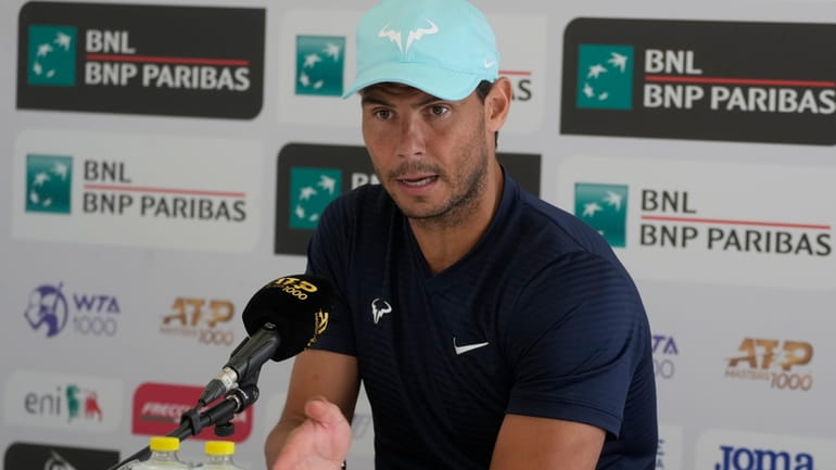 Spain's Rafael Nadal talks to journalists during a press conference...