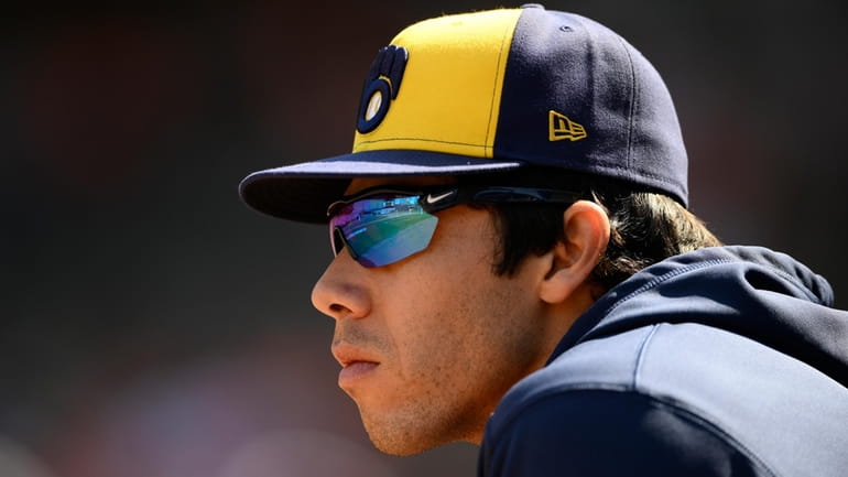 Milwaukee Brewers' Christian Yelich looks on from the dugout during...