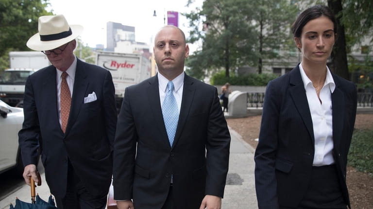 Adam Skelos, center, leaves federal court on Tuesday in Manhattan.
