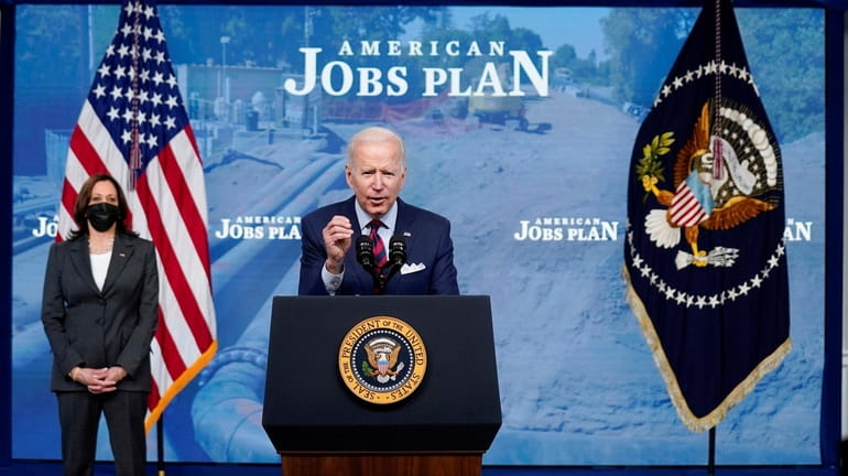 President Joe Biden, with Vice President Kamala Harris, speaks about...