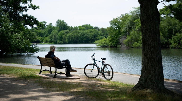 A bicyclist takes a break at Belmont Lake State Park...