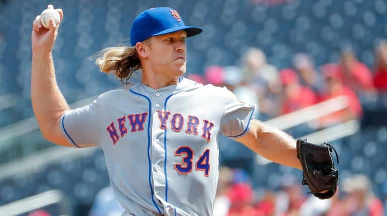 Mets starting pitcher Noah Syndergaard delivers to a Washington Nationals...