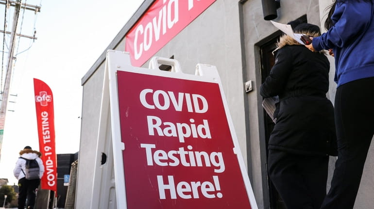COVID-19 tests are offered at an urgent care center in...