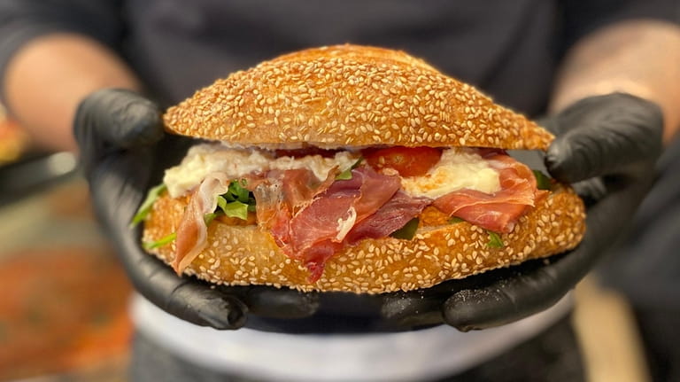 A sandwich on a homemade roll at Dario's Pizza in...