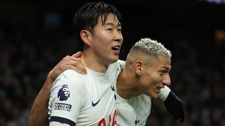 Tottenham's Son Heung-min, left, celebrates with Tottenham's Richarlison after scoring...