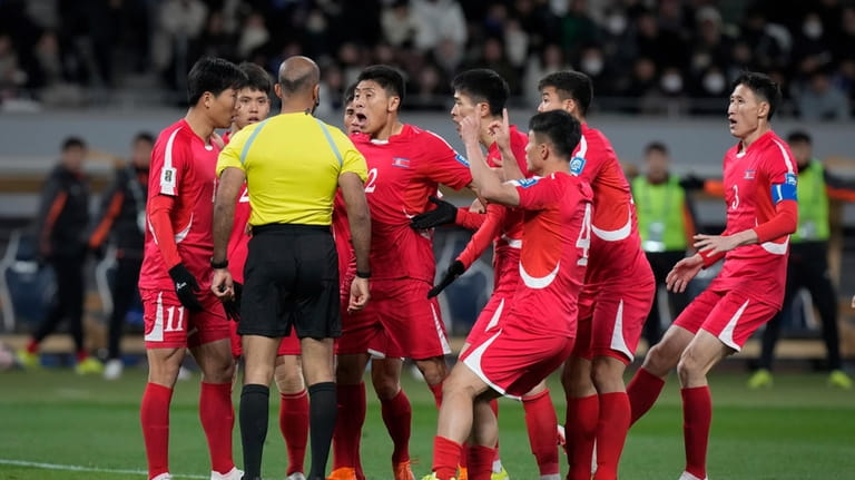 North Korea's players argue with referee during the FIFA World...