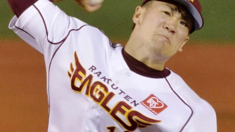 Rakuten Eagles pitcher Masahiro Tanaka pitches against the Yomiuri Giants...