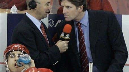 NBC commentator Pierre McGuire, left, interviews Detroit Red Wings coach...