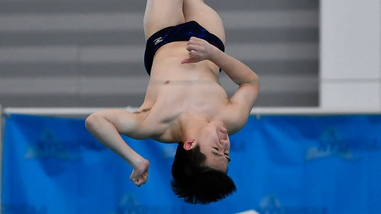 Jericho's Tristan Yang executes a dive during the 2022 NYSPHSAA...