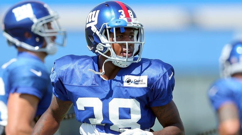 New York Giants cornerback Donte Deayon looks on during training...