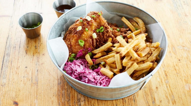 Buttermilk fried chicken with lime chili sauce, jicama-cabbage slaw and...