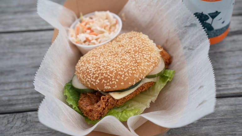 Buttermilk fried chicken sandwich with chipotle ranch, lettuce, pickles and...