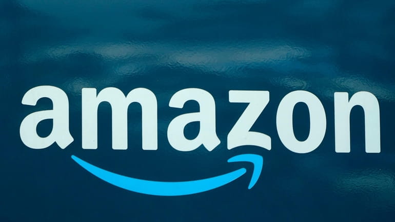 An Amazon logo appears on an Amazon delivery van in...