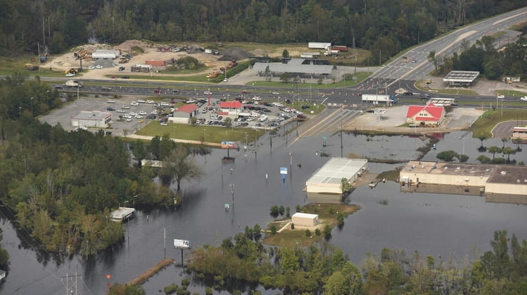 Flood waters from the Neuse River cover the area a...