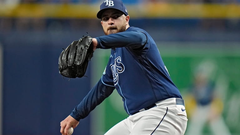 Tampa Bay Rays starting pitcher Aaron Civale goes into his...