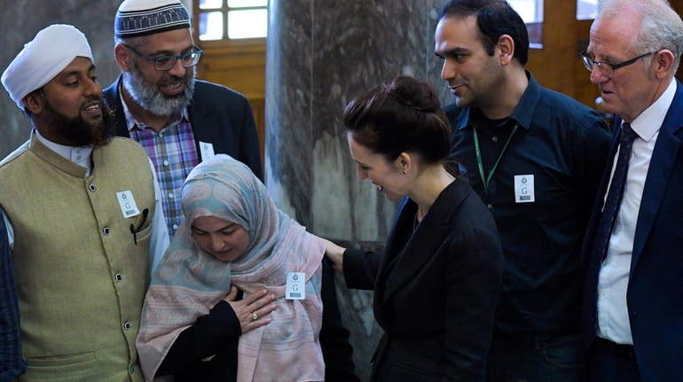 New Zealand Prime Minister Jacinda Ardern (C) meets with Muslim...