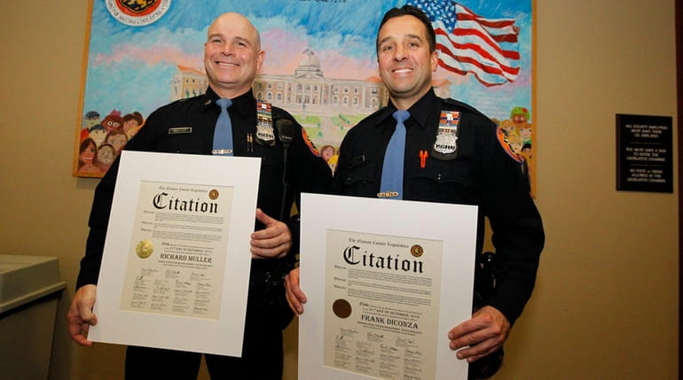 Nassau County police officers Richard Muller and Frank Diconza of...