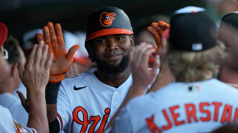 Orioles leftfielder Franchy Cordero is greeted in the dugout after...