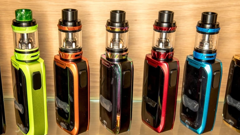 This shows a row of vapes in an Auckland store,...