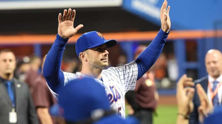 New York Mets third baseman David Wright waves to fans...