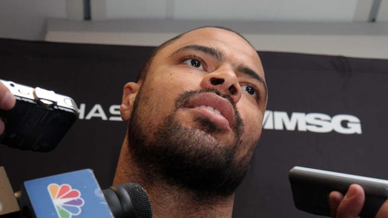 Knicks center Tyson Chandler talks to the media as the...