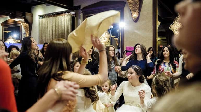 Rabbi Tuvia Teldon's daughter, Chania Kamman, celebrates on her wedding...