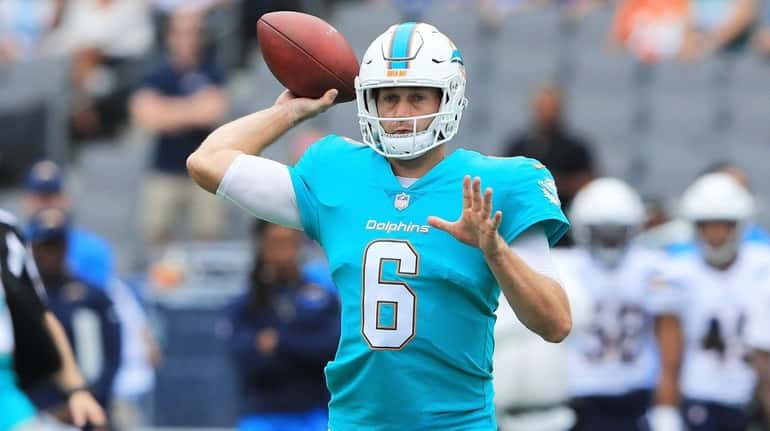 Jay Cutler of the Dolphins throws a pass during the...