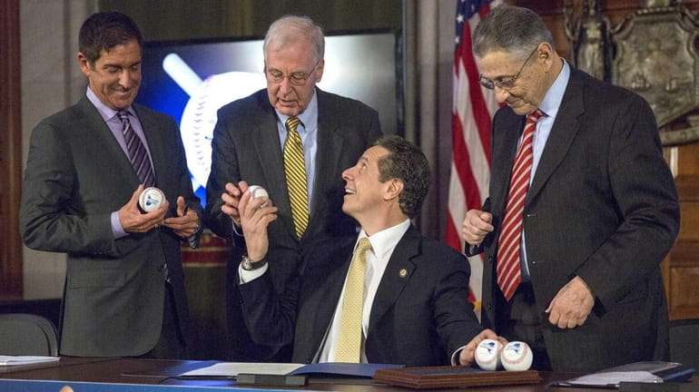 Gov. Andrew M. Cuomo celebrates the signing of the state...
