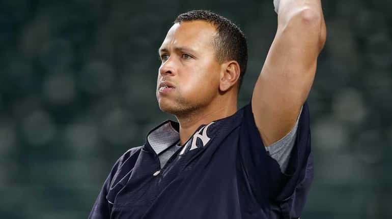 Alex Rodriguez #13 of the New York Yankees warms up...