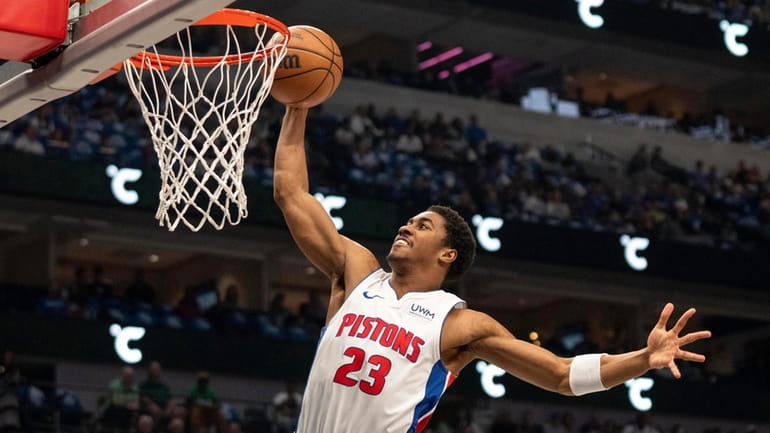 Detroit Pistons guard Jaden Ivey dunks during the first half...