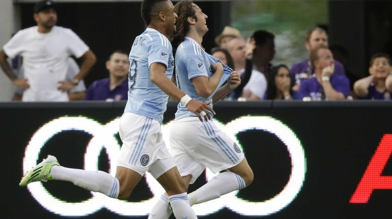 New York City FC's Mix Diskerud, right, celebrates after scoring...