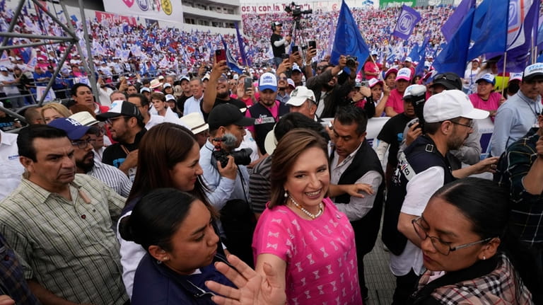 Opposition presidential candidate Xóchitl Gálvez waves as she arrives for...