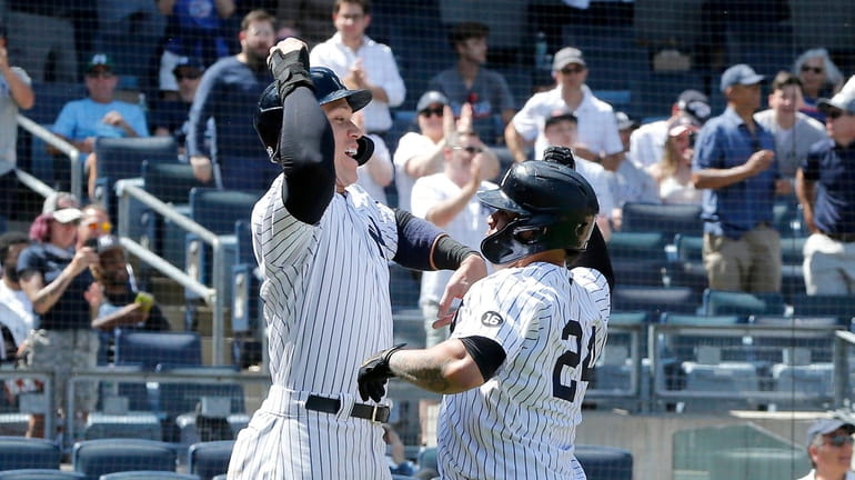 Gary Sanchez #24 of the Yankees celebrates his sixth inning three...