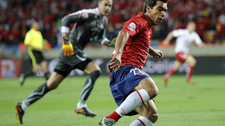 Chile's Esteban Paredes is about to pass the ball to...