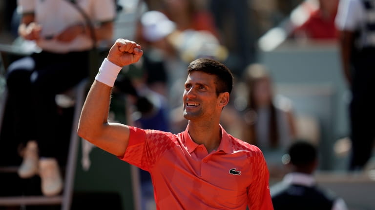 Serbia's Novak Djokovic celebrates after beating Peru's Juan Pablo Varillas...