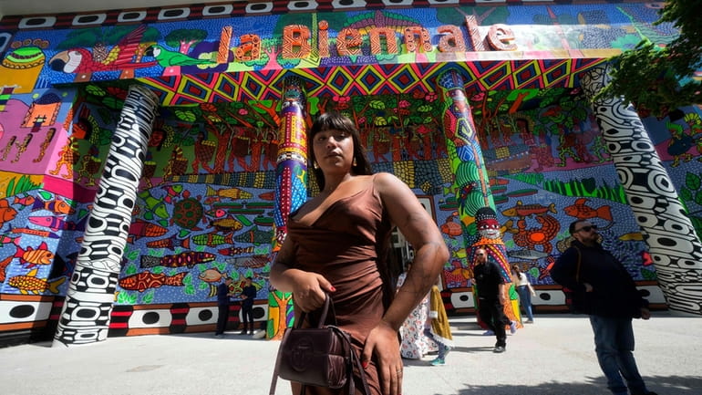 Brazilian artist Manauara Clandestina poses in front of the main...