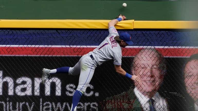 Mets' Jeff McNeil can't catch a grand slam hit by...