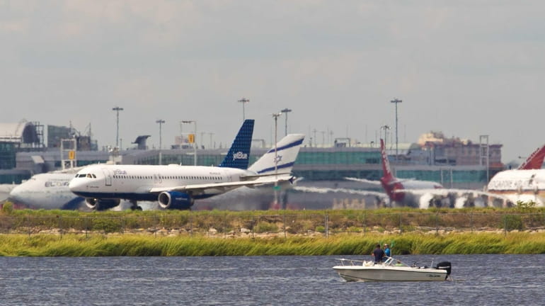 Airplanes on the runway of John F. Kennedy International Airport...