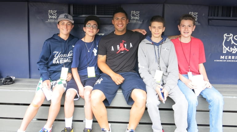 Yankees player Gleyber Torres, center, with Kidsday reports Andrew Galligan,...