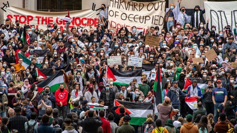 Demonstrators at Harvard University show their support for Palestinians in...