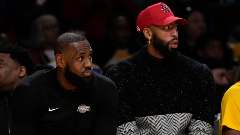 Los Angeles Lakers forward LeBron James, left, and Anthony Davis...
