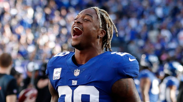 Xavier McKinney of the Giants celebrates after defeating the Baltimore Ravens...