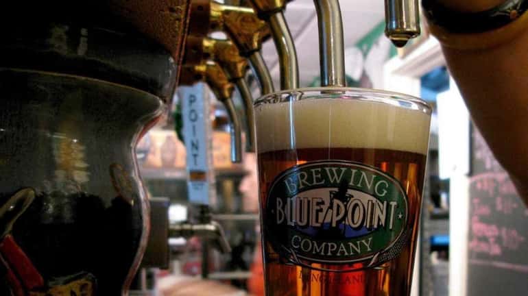 A pint of craft beer is tapped at Blue Point...
