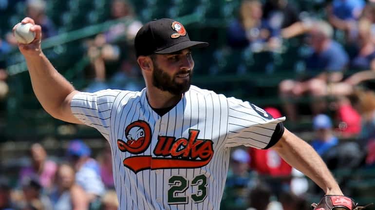 Long Island Ducks starting pitcher Travis Banwart delivers a pitch...