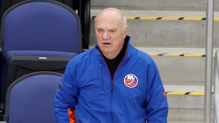 New York Islanders general manager Lou Lamoriello watches his team...