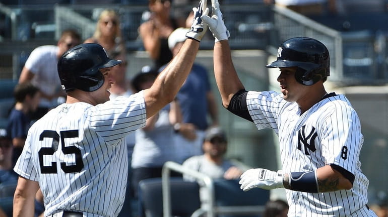 New York Yankees' first baseman Mark Teixeira greets rookie catcher...