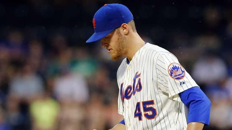 Zack Wheeler #45 of the New York Mets stands on...