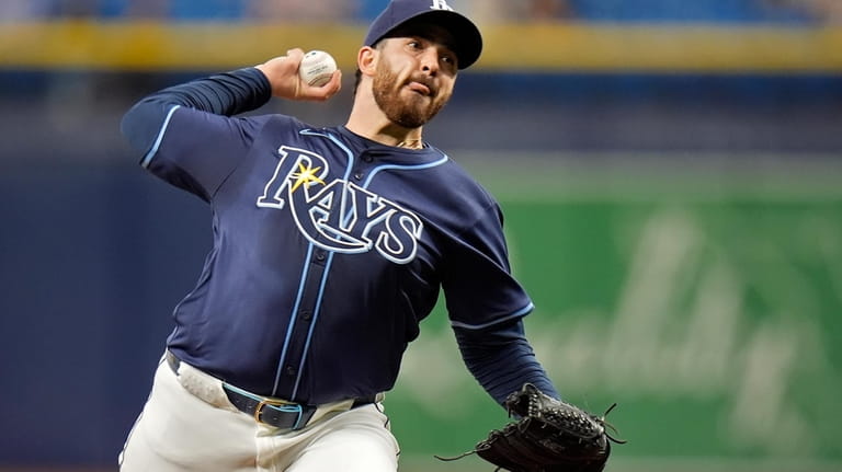 Tampa Bay Rays starting pitcher Aaron Civale delivers to a...