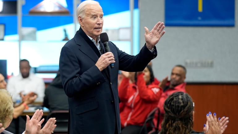 President Joe Biden meets with UAW members during a campaign...